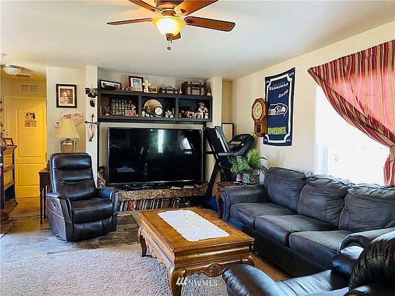 living room with built in space for large tv 