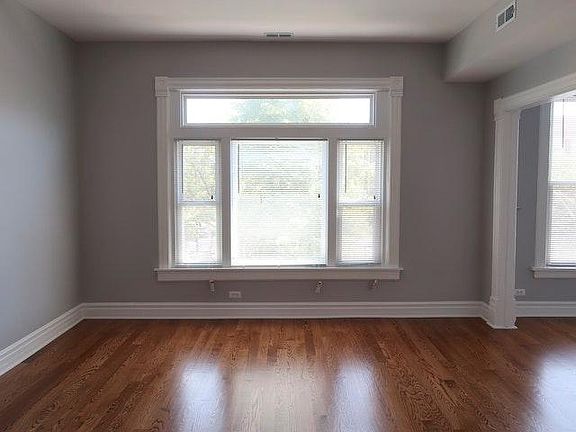 Front Room with new windows and hardwood