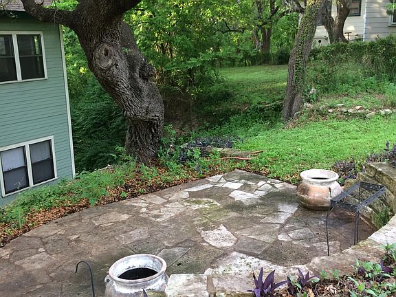 Rock patio tucked into the slope