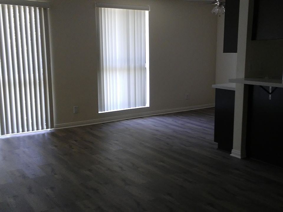Living-dining room area with laminate floors.