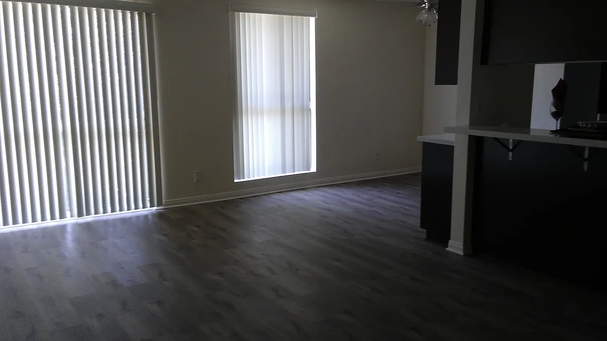 Living-dining room area with laminate floors. - Yellow Roses