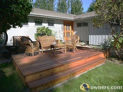 Front yard with house entrance and deck