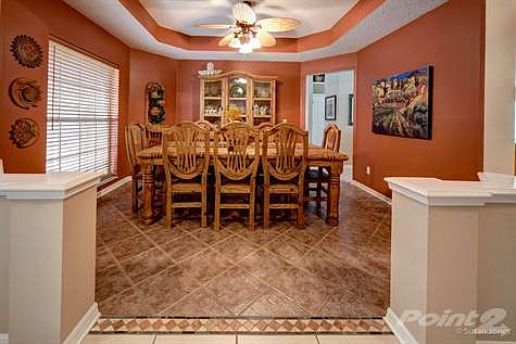 FAMILY AND GUESTS WILL DINE IN UNCROWDED COMFORT IN THIS SPACIOUS DINING ROOM