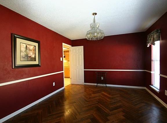 Spacious formal dining opens to kitchen for easy entertaining.
