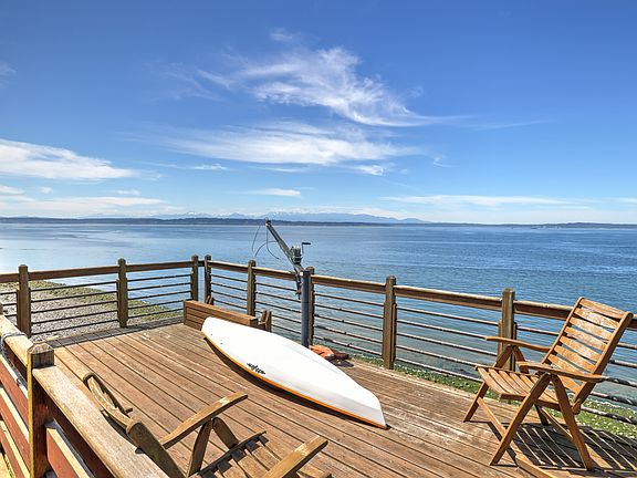 deck with water views showing one of the kayaks