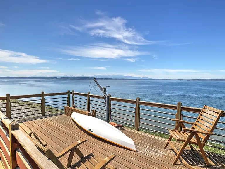 deck with water views showing one of the kayaks