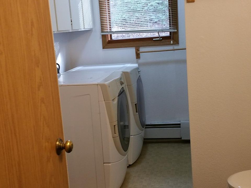 Laundry in bathroom. Shower opposite laundy.
