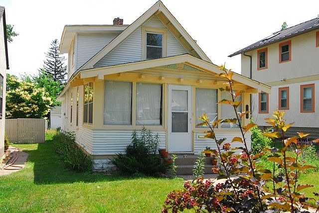 Chalet-style 1 1/2 story in the Victory neighborhood.