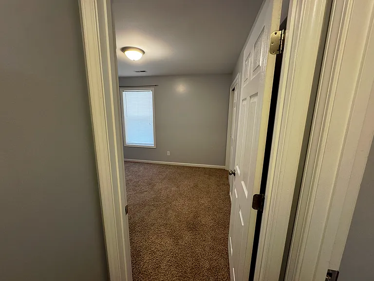 View of the third bedroom taken from the hallway.