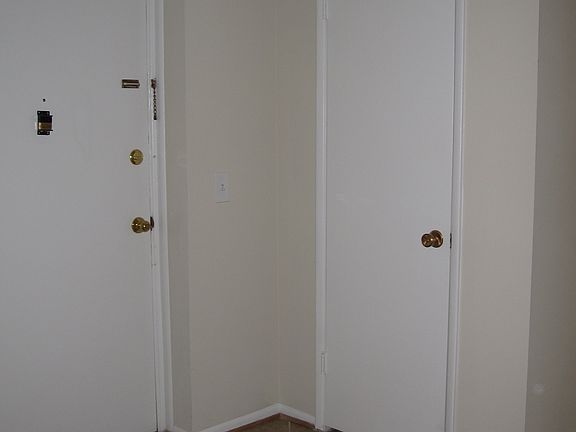 Ceramic tile entrance, coat closet on right