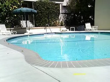 Community Pool with nearby Laundry Room uses Phone App.