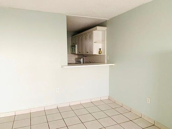 Dining area with kitchen bar.