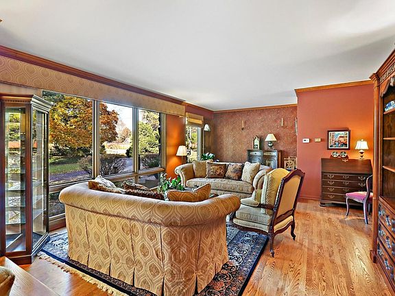 Sun-filled living room with hardwood floors.