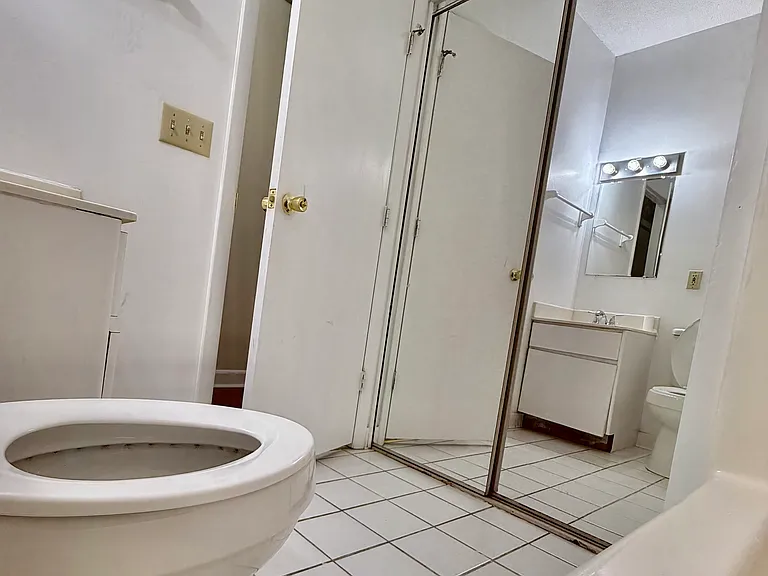 2nd bathroom. lots of storage. closets behind mirrored doors.