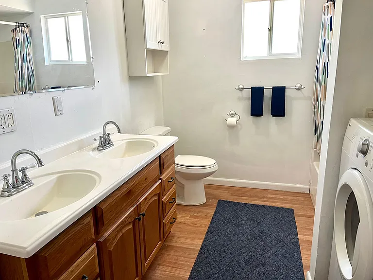 Double sinks, indoor laundry, tub/shower.