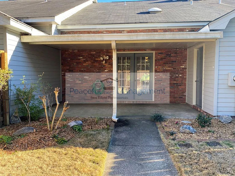 Covered patio with storage room