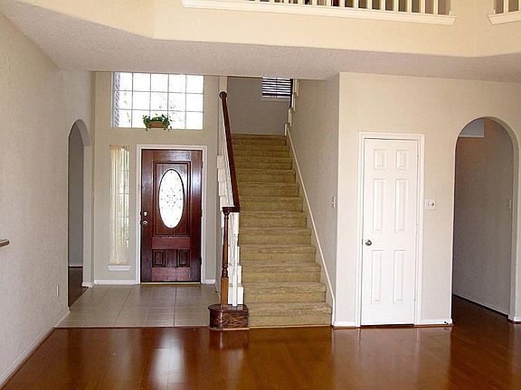 The entry greets you with ceramic tile flooring and a leaded glass front door.