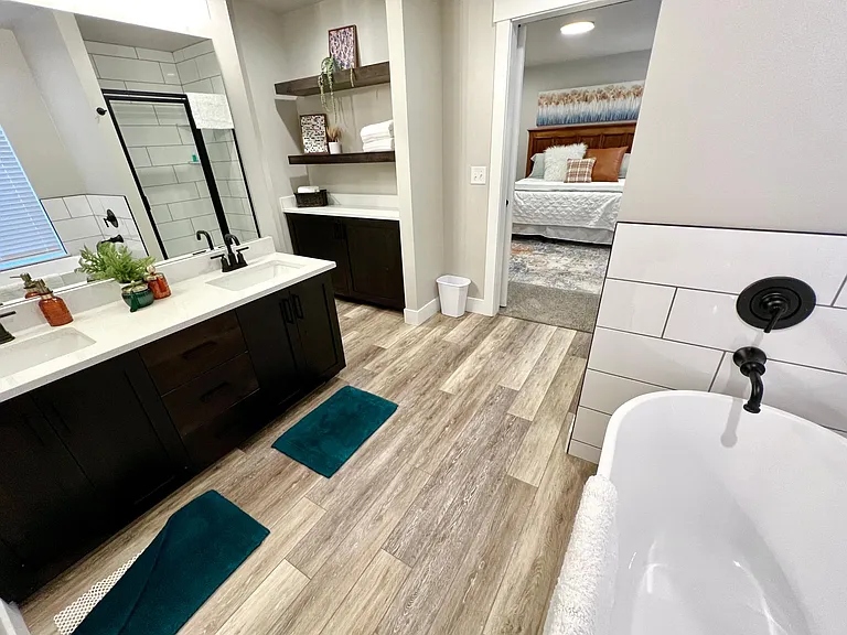 Dual sink vanity with quartz countertop.