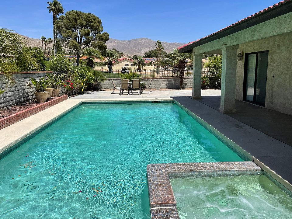 Backyard: Pool and Jacuzzi with Golf Course and Mountain Views