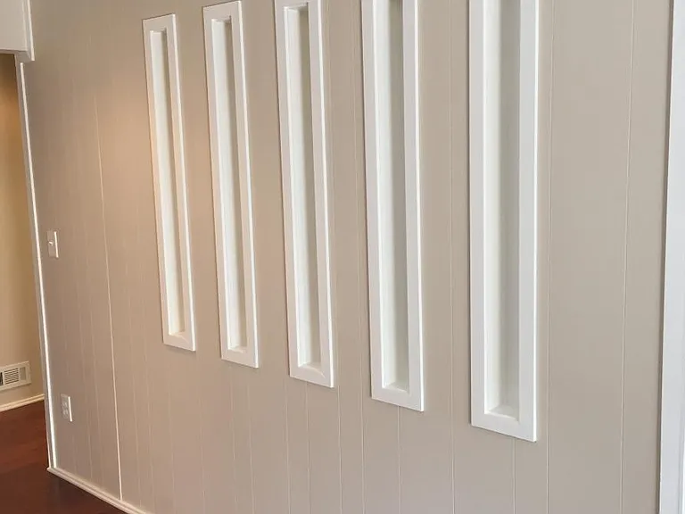 Across from hall closet