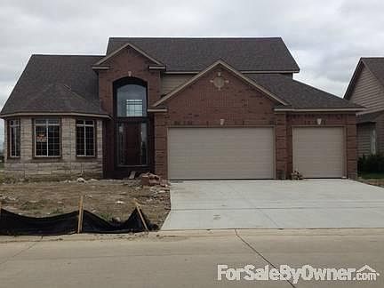 Front View
						:
						Custom brick and stone work