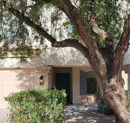 Front with shade tree