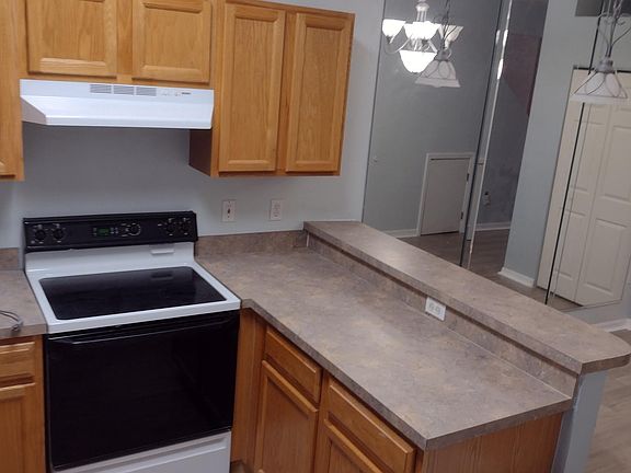 Kitchen overlooks the dining area and pantry.