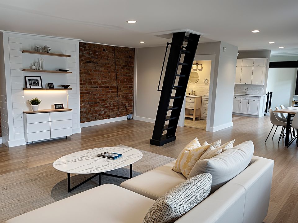 Living room with private rooftop deck entrance. Beyond dining room is kitchen and study.