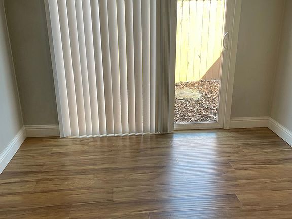 bedroom 1 with access to fenced private patio