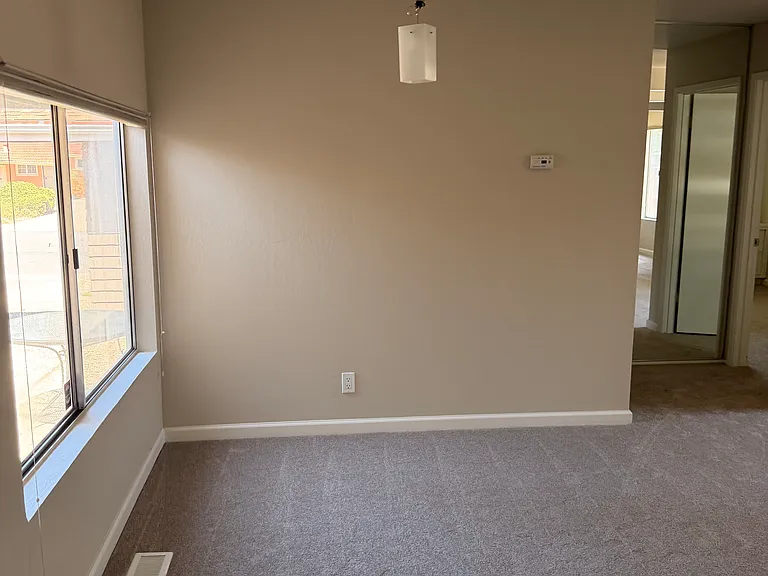 extra dining area optional with overhead lamp, window faces the courtyard, in family/living room