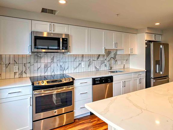 Select homes feature upgraded kitchens with quartz countertops