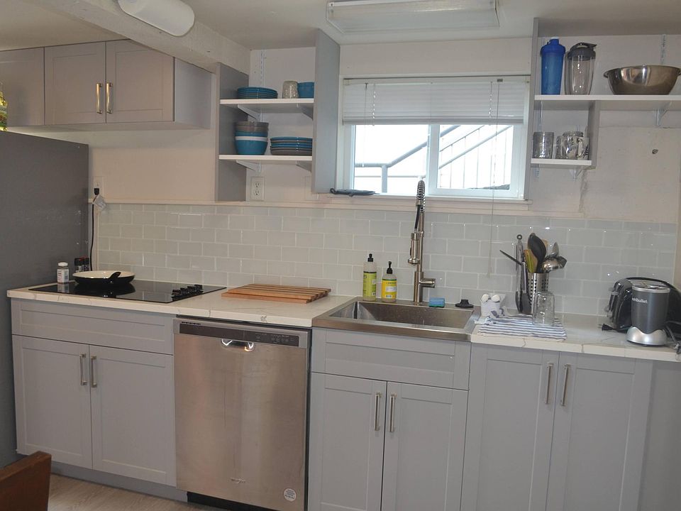 The kitchen is newly remodeled and features stainless steel refrigerator and dishwasher.