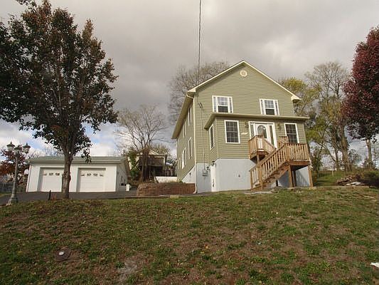 FRONT VIEW OF HOUSE & TWO CAR GARAGE