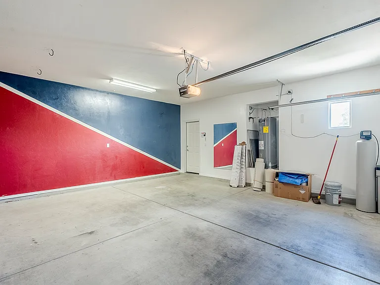 garage view 2/2 with workout mirror and water softener