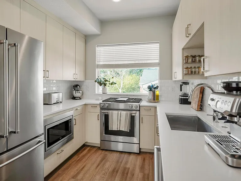 Kitchen with stainless steel appliances and gas range