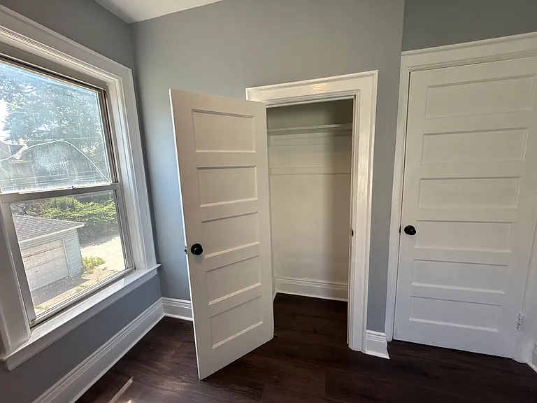 Bedroom 1 with 2 windows and 1 closet