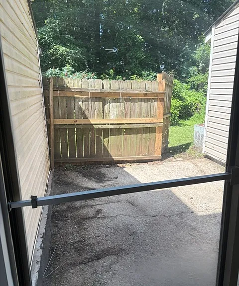 Fenced in back porch with privacy