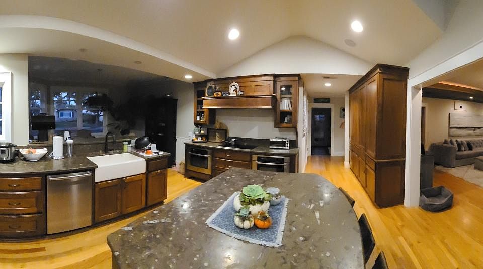 360 view of kitchen, with the nook the left, access to the laundry room in the middle and the living room on the right