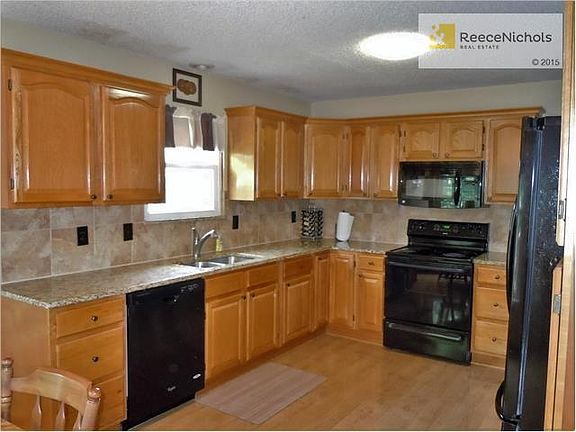 New granite counter top and tile backsplash. Updated cabinets and laminate flooring