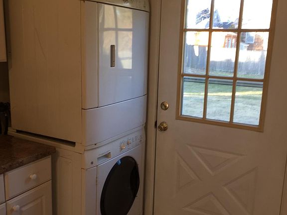 Washer Dryer in kitchen. Door to the back yard.