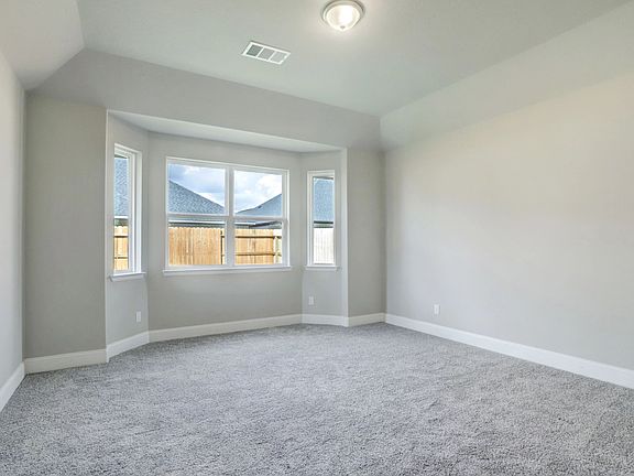 Primary bedroom with bay window