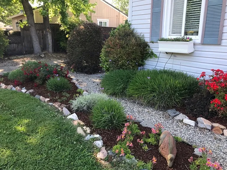 Garden pathway connecting driveway to front door.