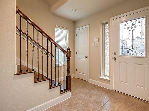 The entry way has lots of natural lighting and a coat closet.