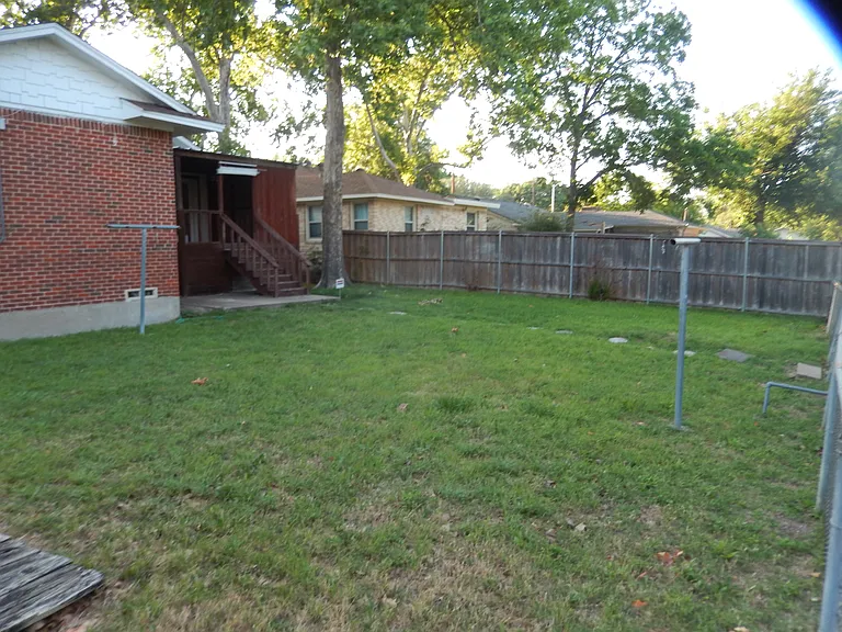 Backyard facing the covered deck.