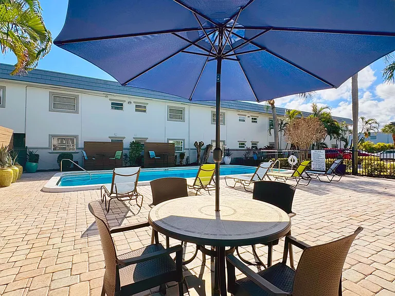 Our expansive sundeck features shaded seating and modern lounge chairs.
