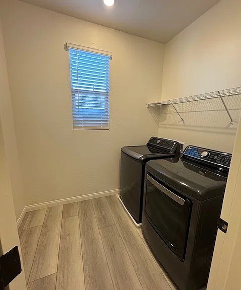 Laundry room off Loft with a separate linen closet