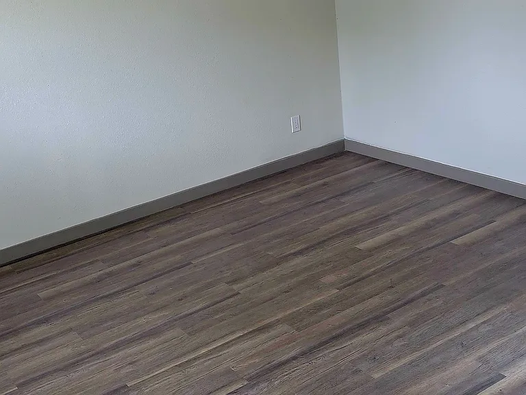 Livingroom features new ceiling and flooring