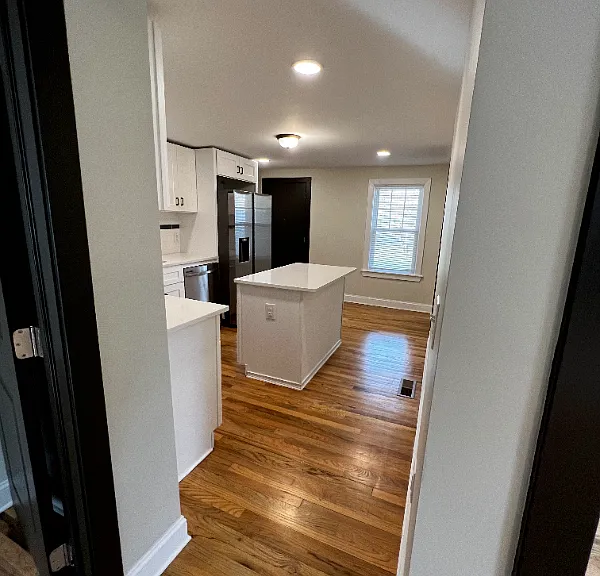 Beautiful kitchen with gas stove, mounted microwave, and dishwasher.