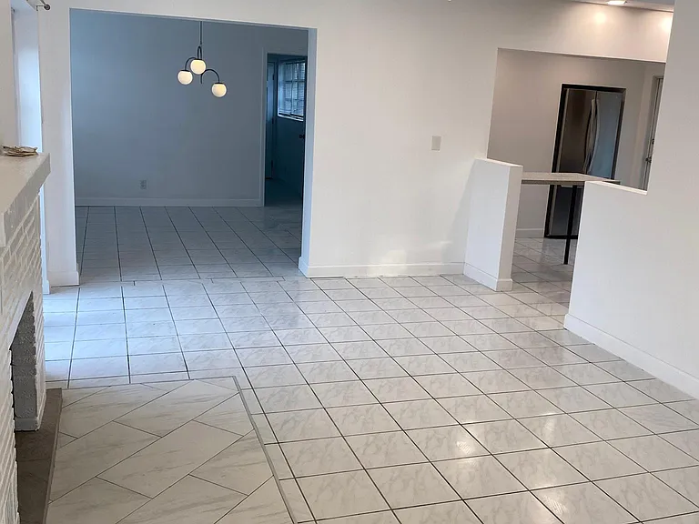 View of living room with dinning room and kitchen