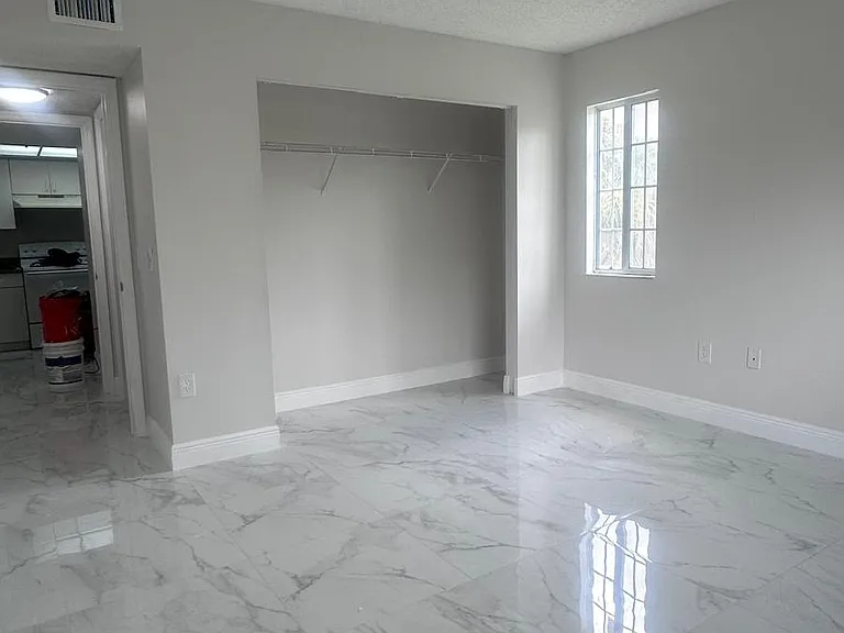 5011 Wiles Rd #207 — Photo 1